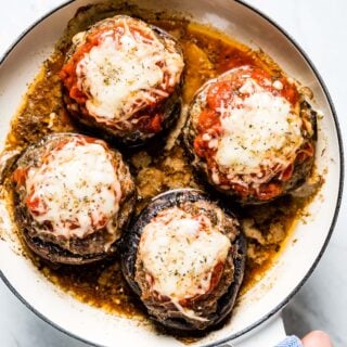 skillet with stuffed mushrooms with cheese