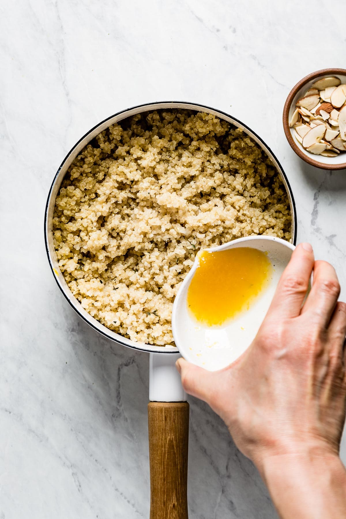 pouring lemon into quinoa