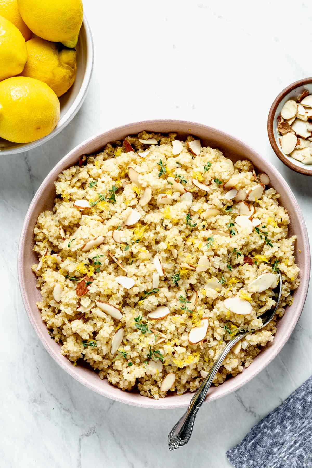 lemon quinoa in a pink bowl from overhead