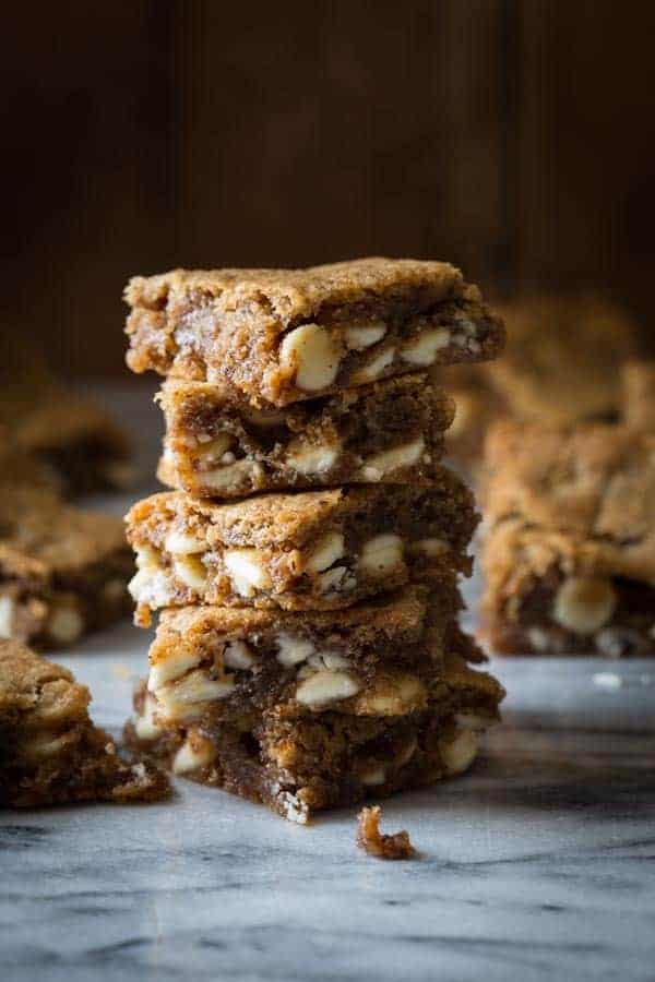 gluten-free maple white chocolate blondies stacked on top of each other