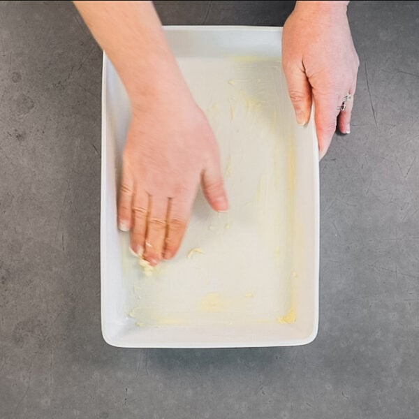buttering the casserole dish
