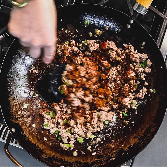 the spices sprinkled over the pork