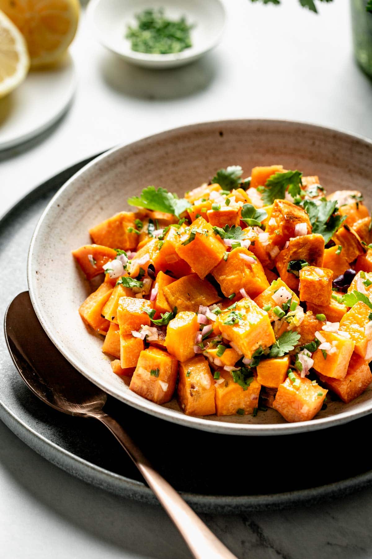 side view of sweet potatoes with lemon and cilantro