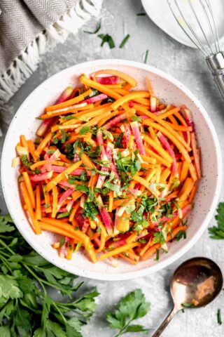 overhead of white bowl with radish salad