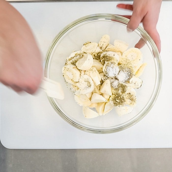 Toss the parsnips with salt, herbs and oil