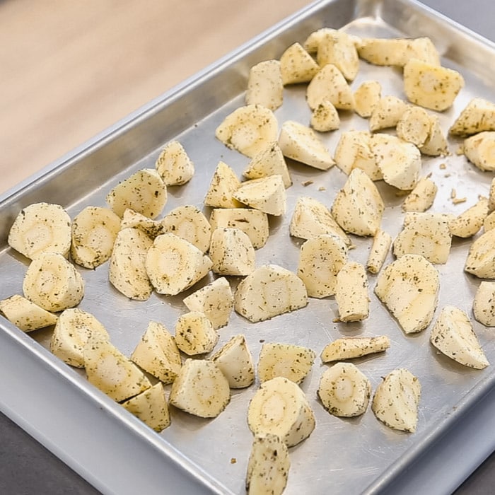 Spread the parsnips on a baking sheet