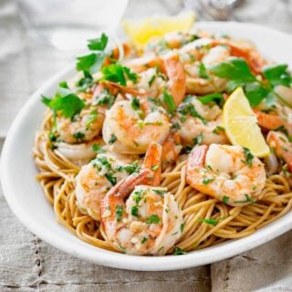 shrimp on a platter on pasta