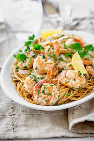 shrimp on a platter on pasta