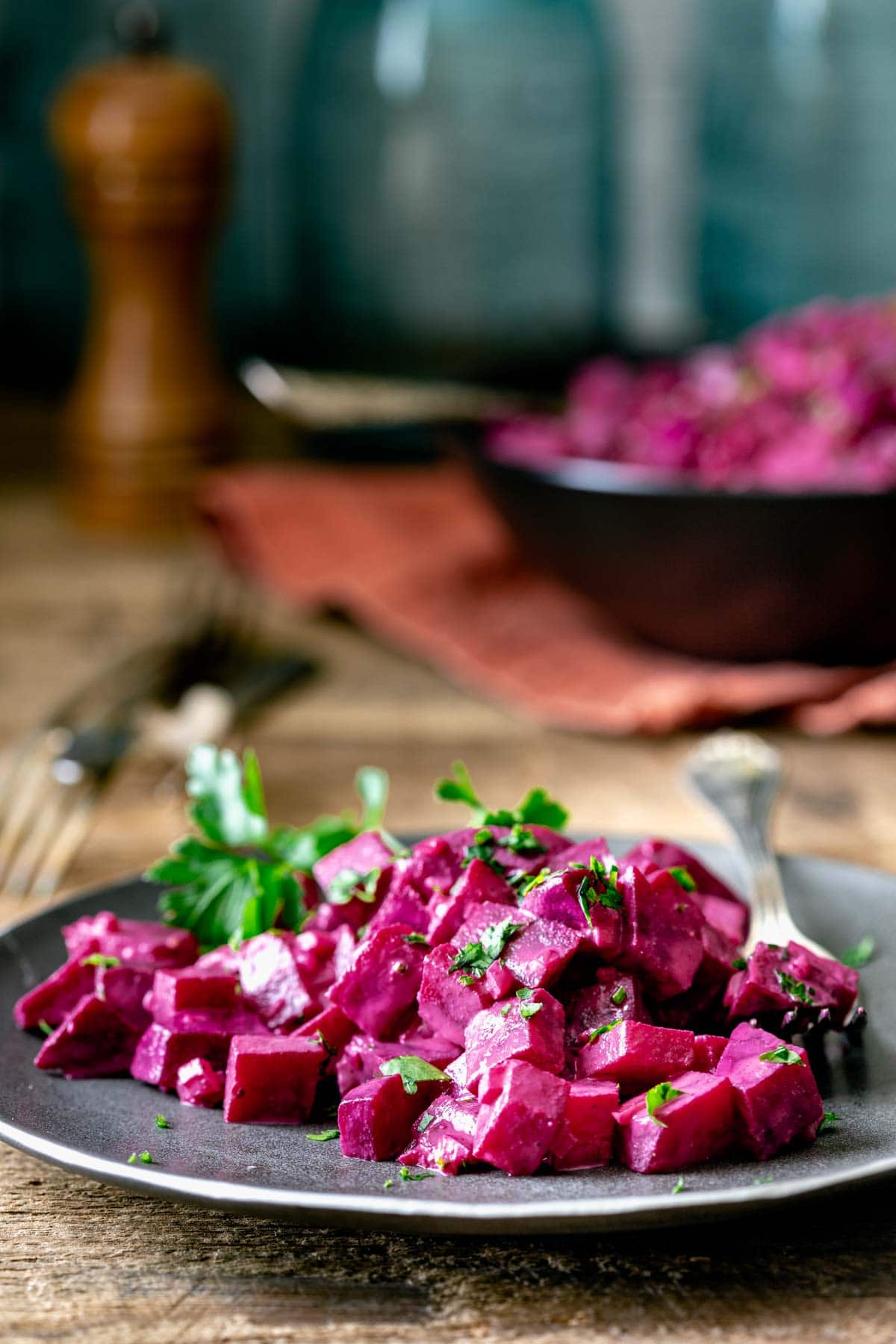 side view of beets on a plate with parsley