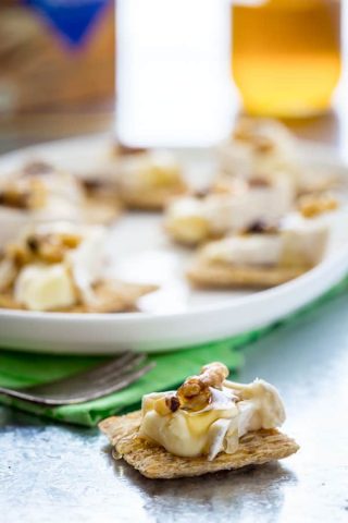 Brie Honey and Walnut Bites, Just 3 simple toppings on a Triscuit cracker for an easy, sweet and savory appetizer or snack.