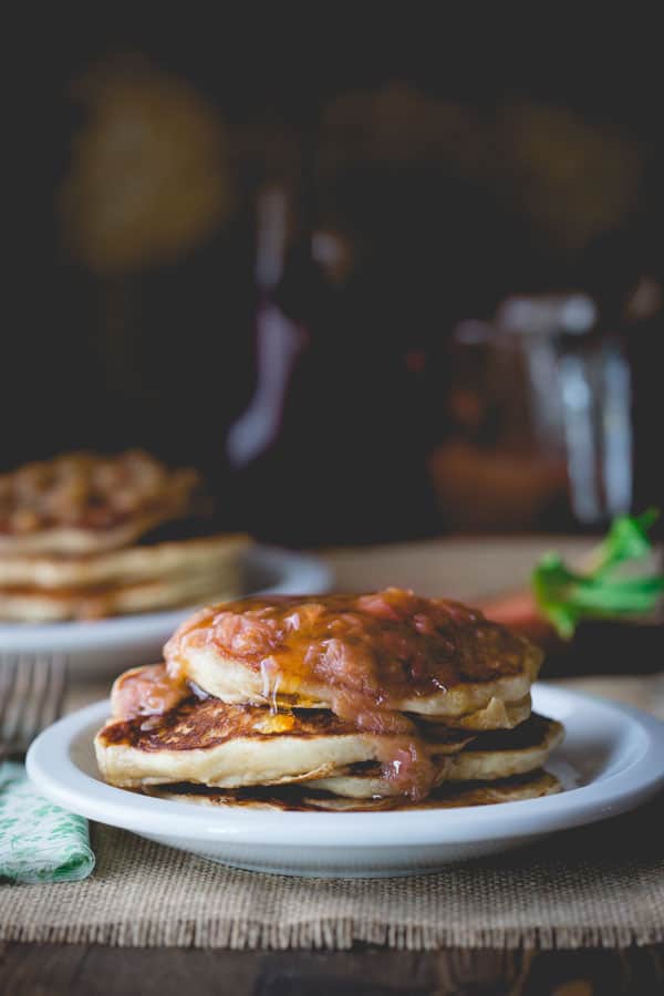 Lemon Almond Ricotta Pancakes with Rhubarb Maple Compote on a plate