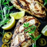 grilled chicken with oregano sprigs