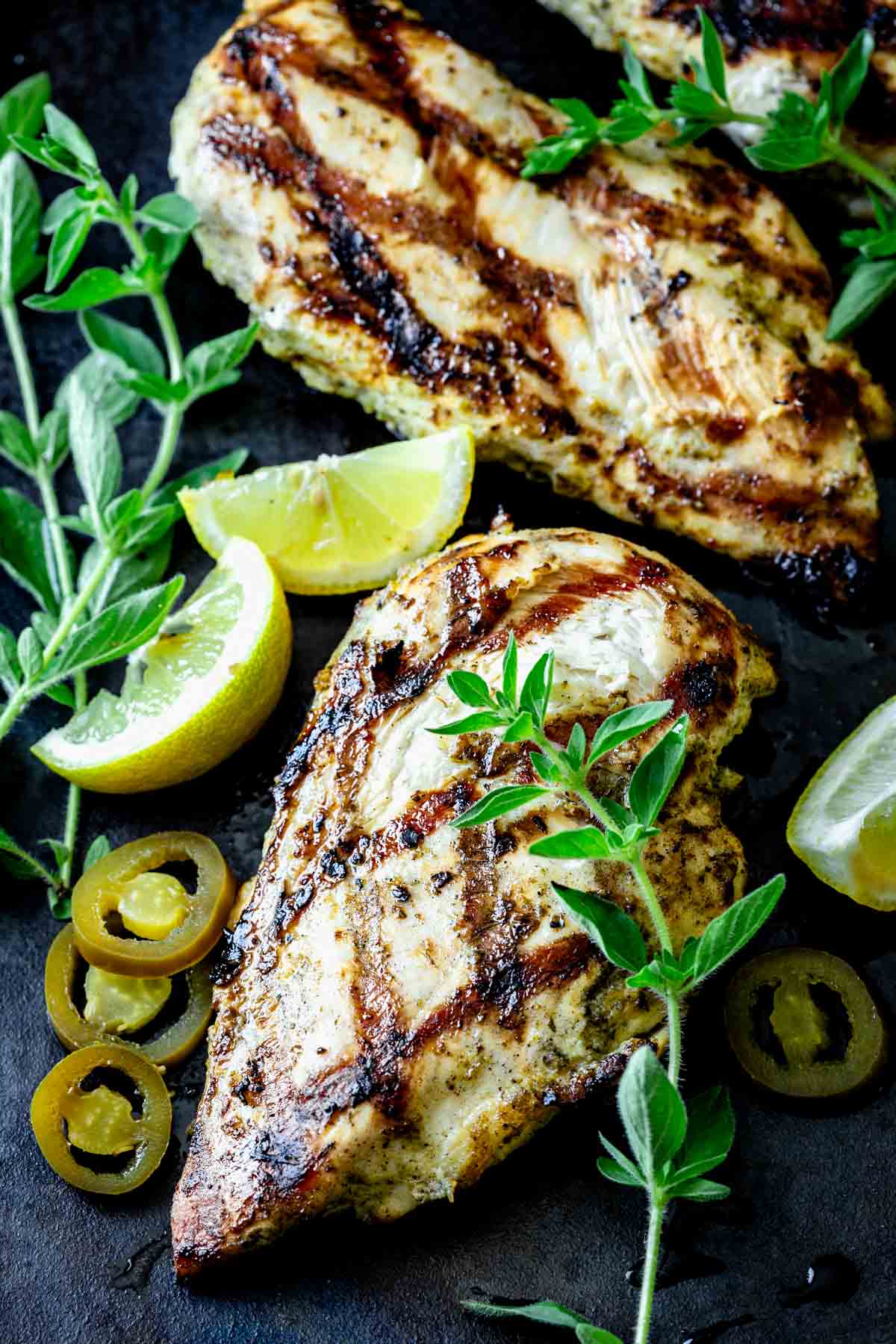 grilled chicken with oregano sprigs