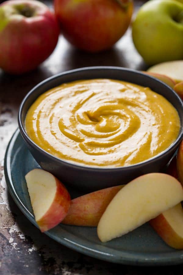 Maple Pumpkin Pie Dip in bowl with apple slices