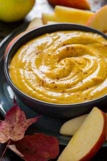 close up of pumpkin dip with apple slices