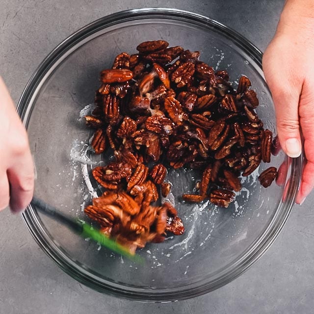 Stir the nuts into the whites and coat them completely
