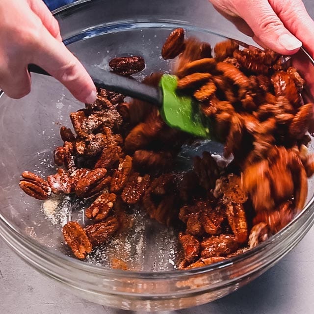 stirring the spices into the nuts