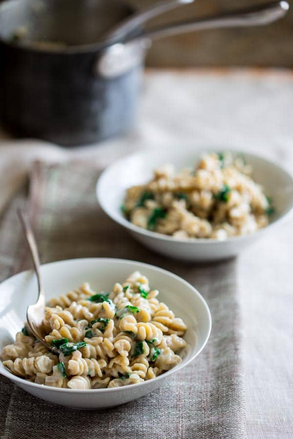 Mac and Cheese with Kale in bowls with spoons