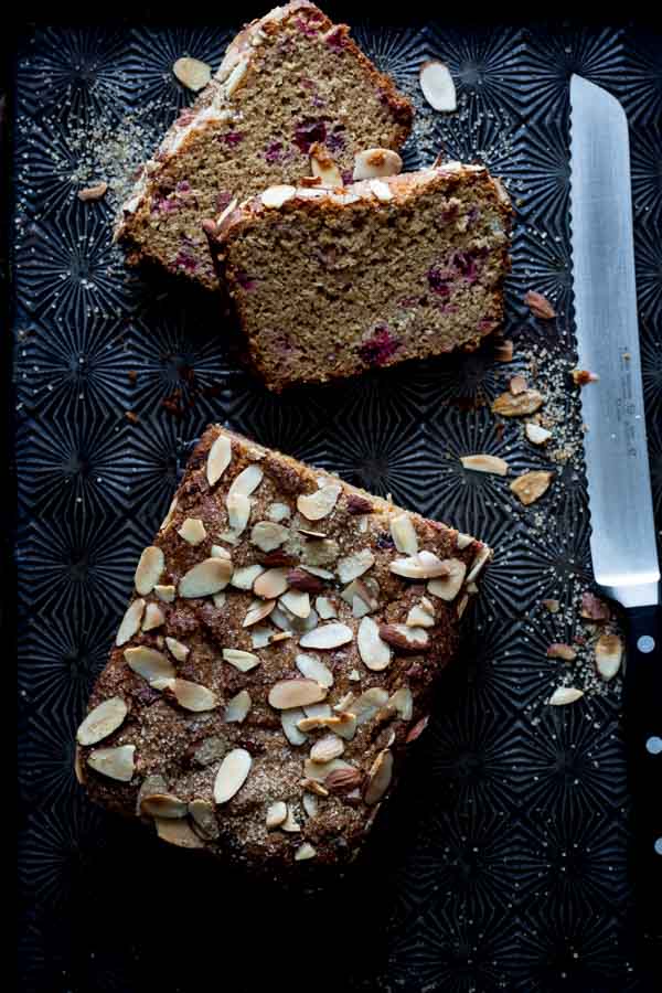 almond cranberry bread loaf sliced with knife