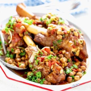 slow cooked lamb shanks with chickpeas on a platter