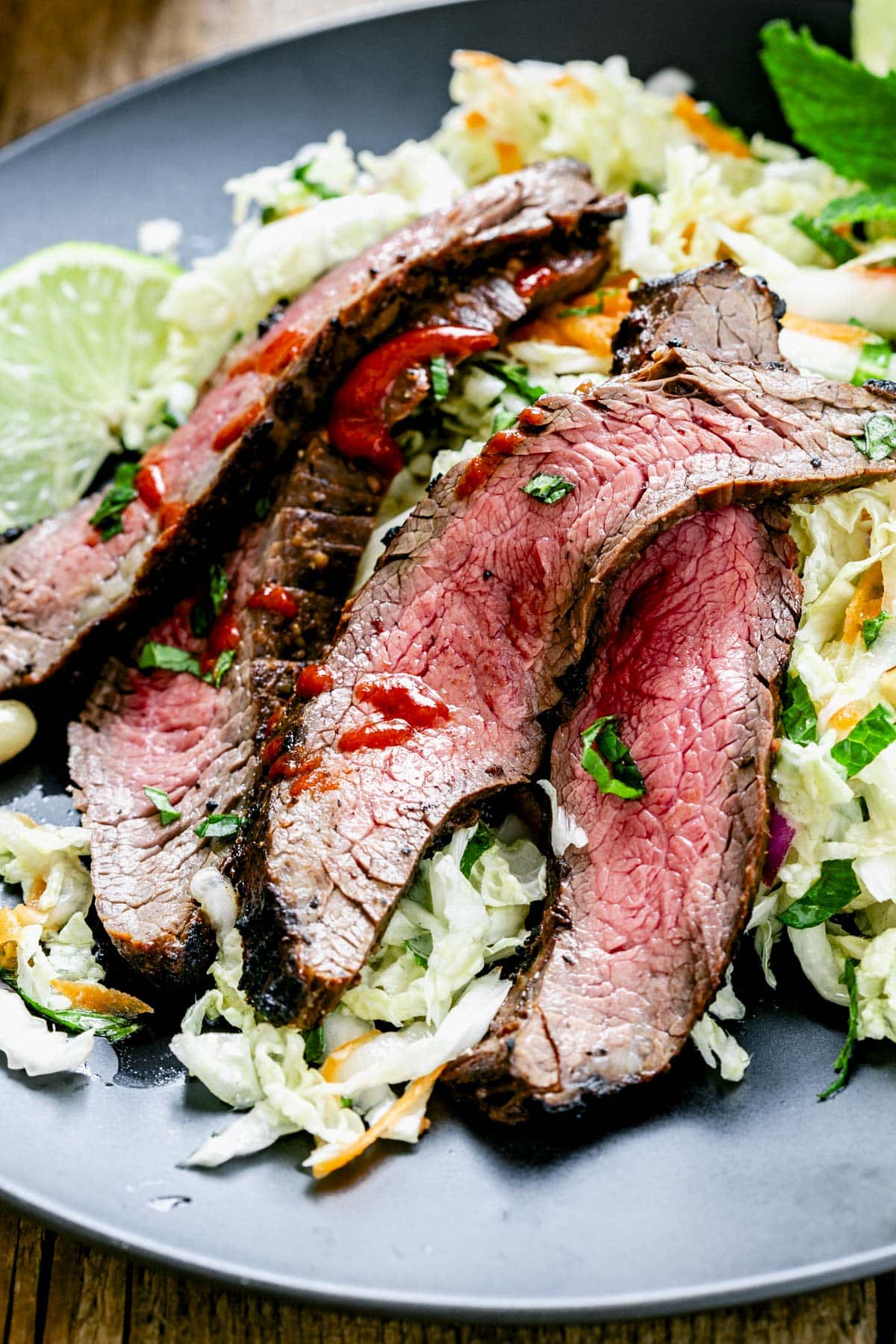 The steak on top of the Napa salad