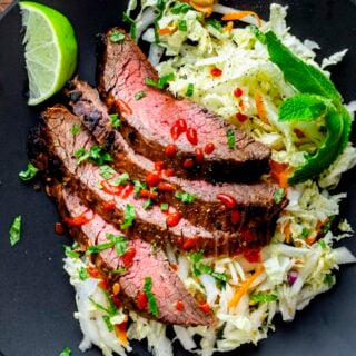 the steak on top of the Napa slaw