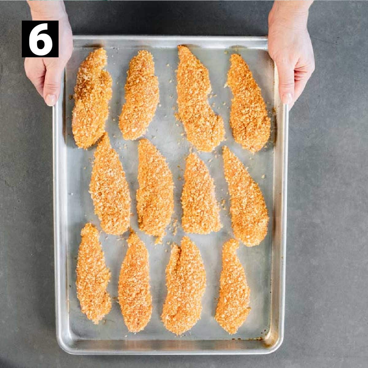 the breaded chicken fingers before they are baked