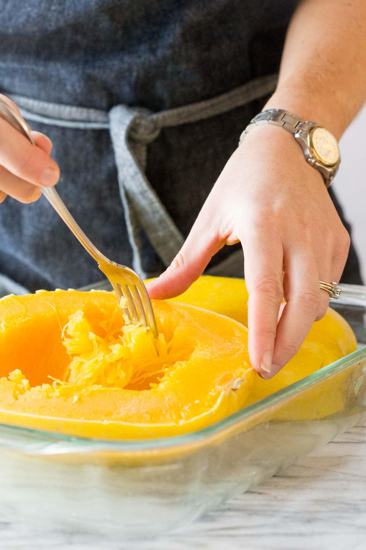 scraping up the strands of spaghetti squash with a fork
