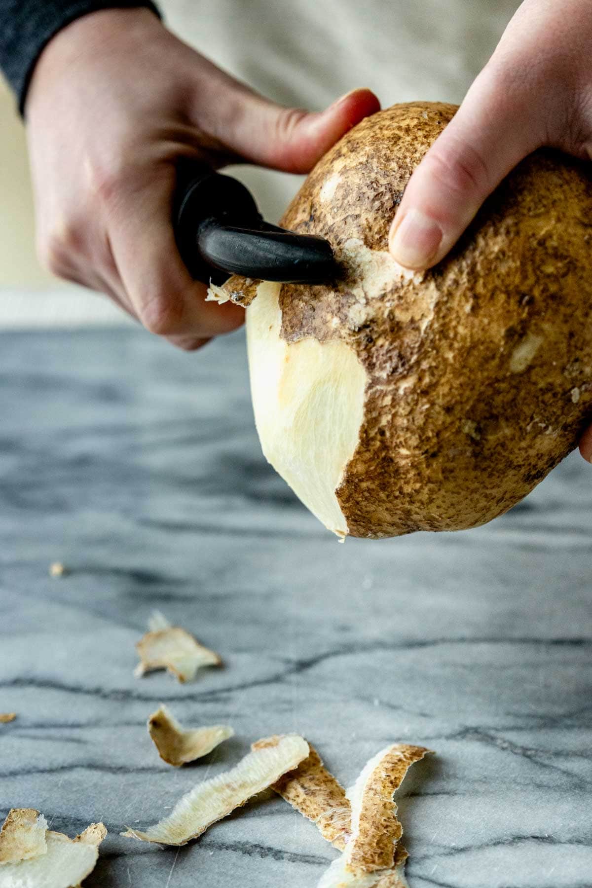 peeling the jicama