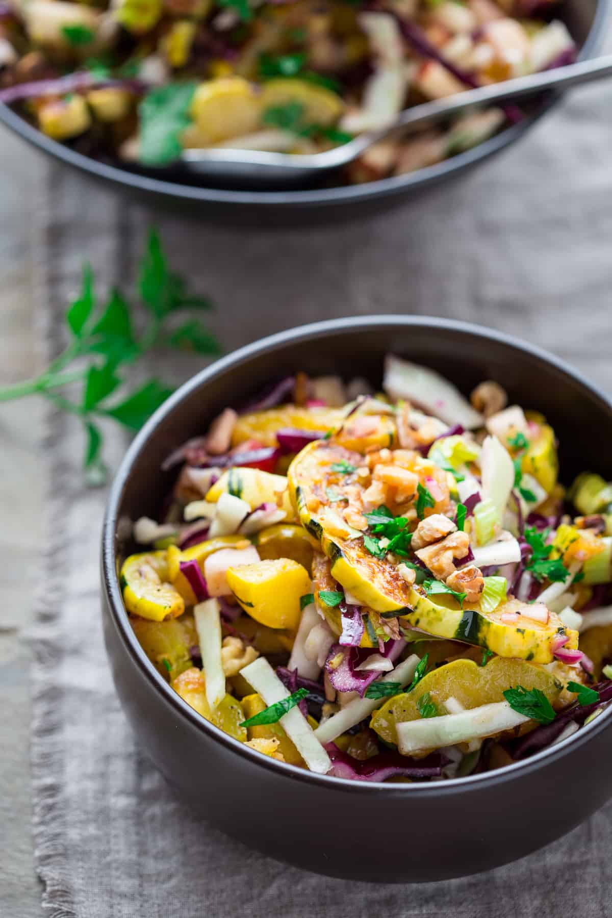 Delicata Salad with Warm Pickled Onion Dressing in a bowl