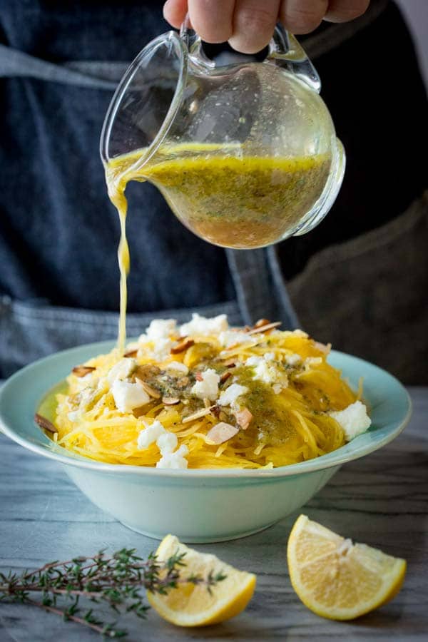 Pouring dressing over Cold Spaghetti Squash Salad