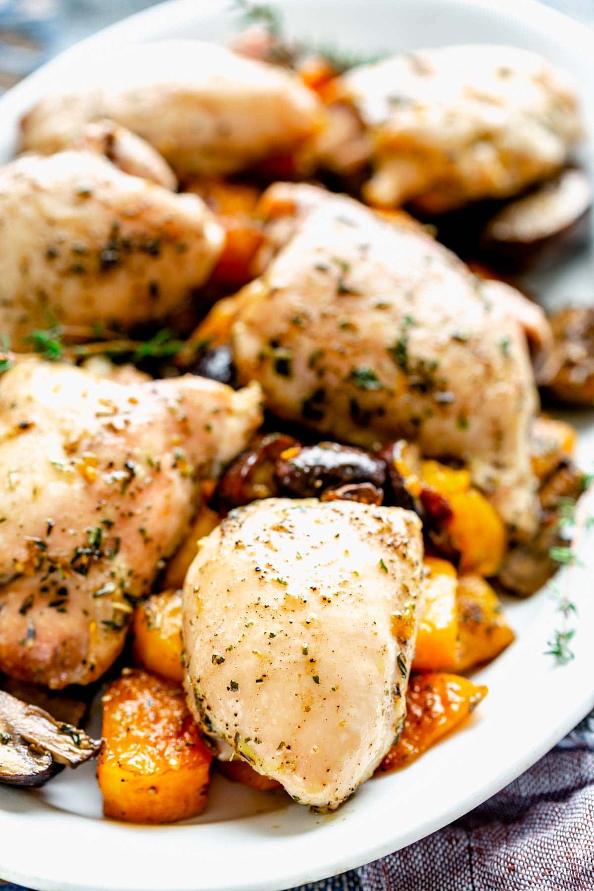 close-up of chicken and squash sheet pan dinner on a platter