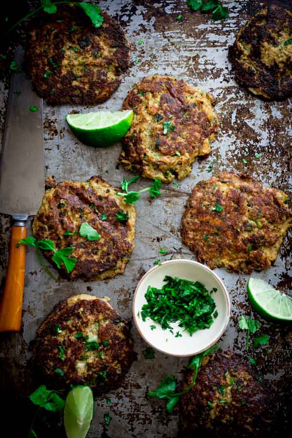 low carb cauliflower patties with mexican flavoring on a tray