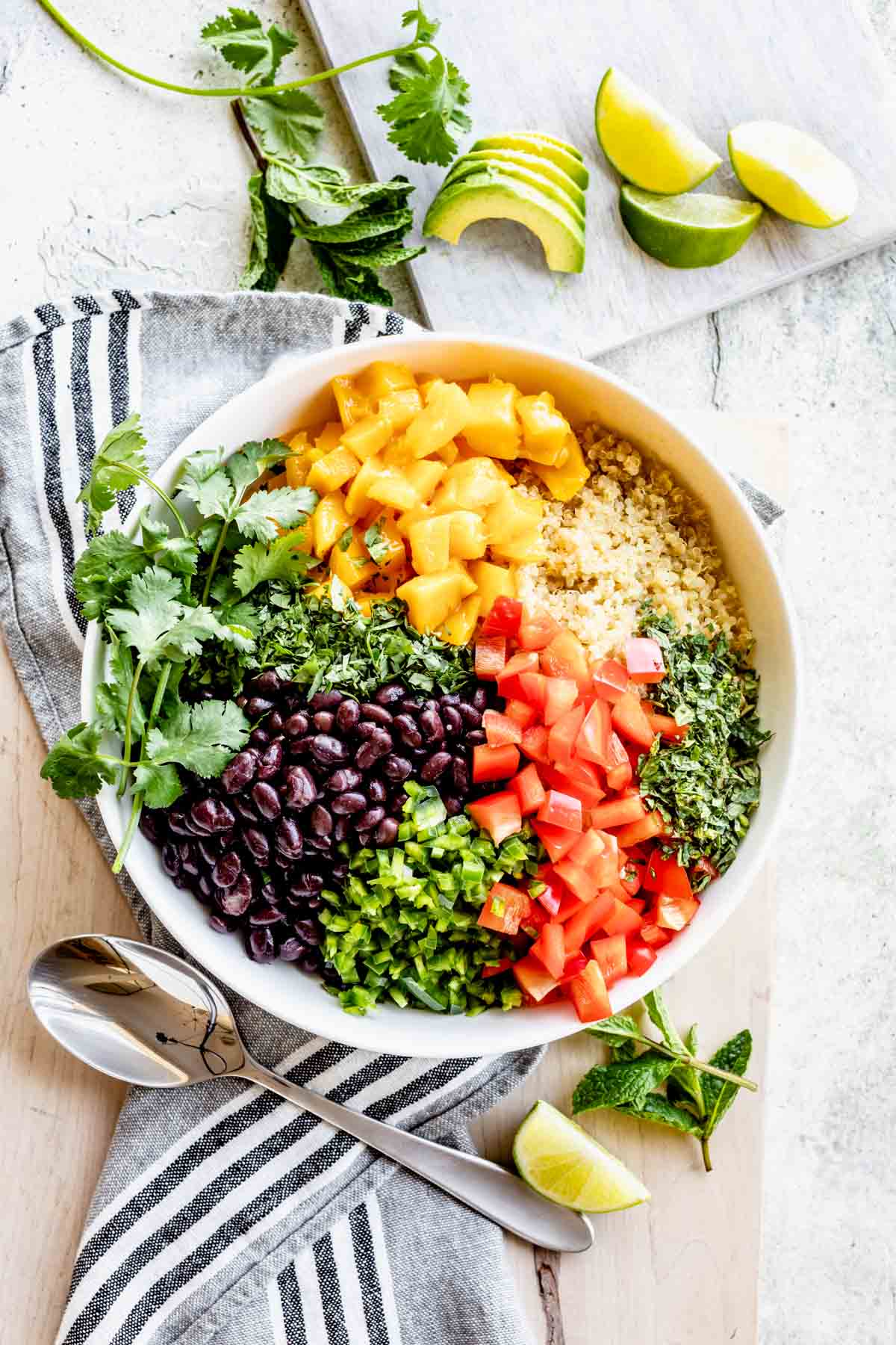 the salad with the veggies and fruit on top before they are stirred into the quinoa