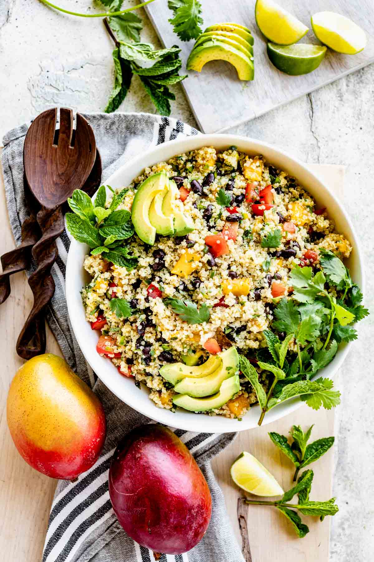 overhead table scape with the bowl of salad and two mangos