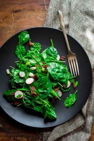 Spinach and Scallion Salad with HOT BACON dressing! Oh my! You need this salad in your life! on HealthySeasonalRecipes