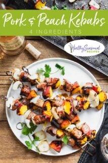 a platter of peach and pork kebabs
