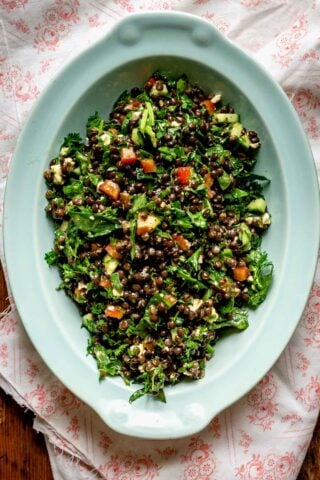 blue oval bowl with black lentil salad