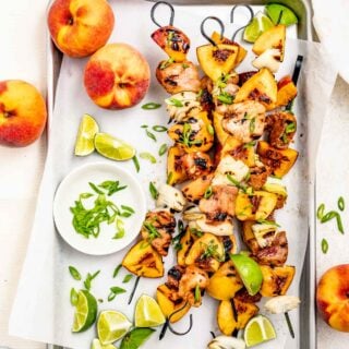 pork kebabs with peaches on a sheet pan