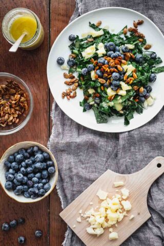 a plate of salad with the mise en place around it