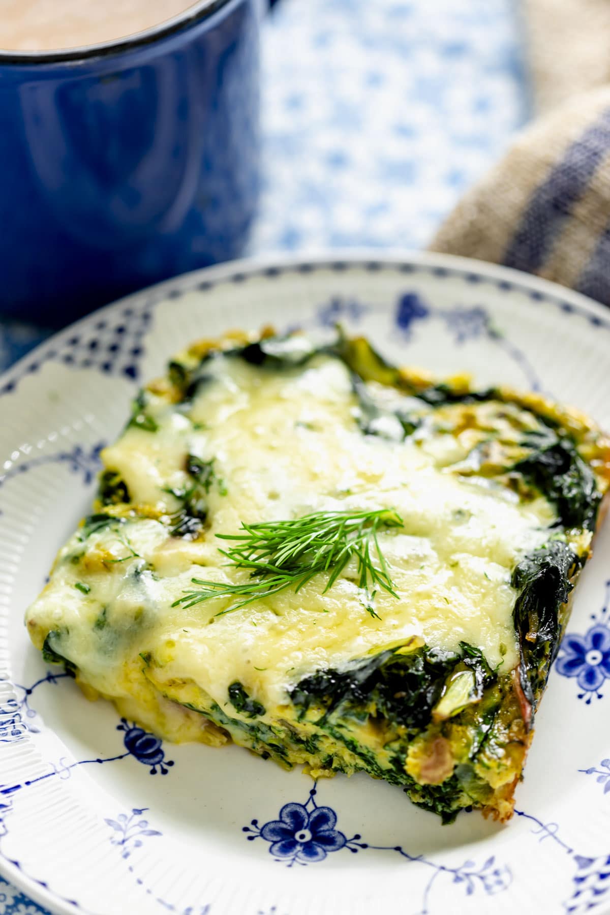 a serving of the chard egg bake on a blue and white plate