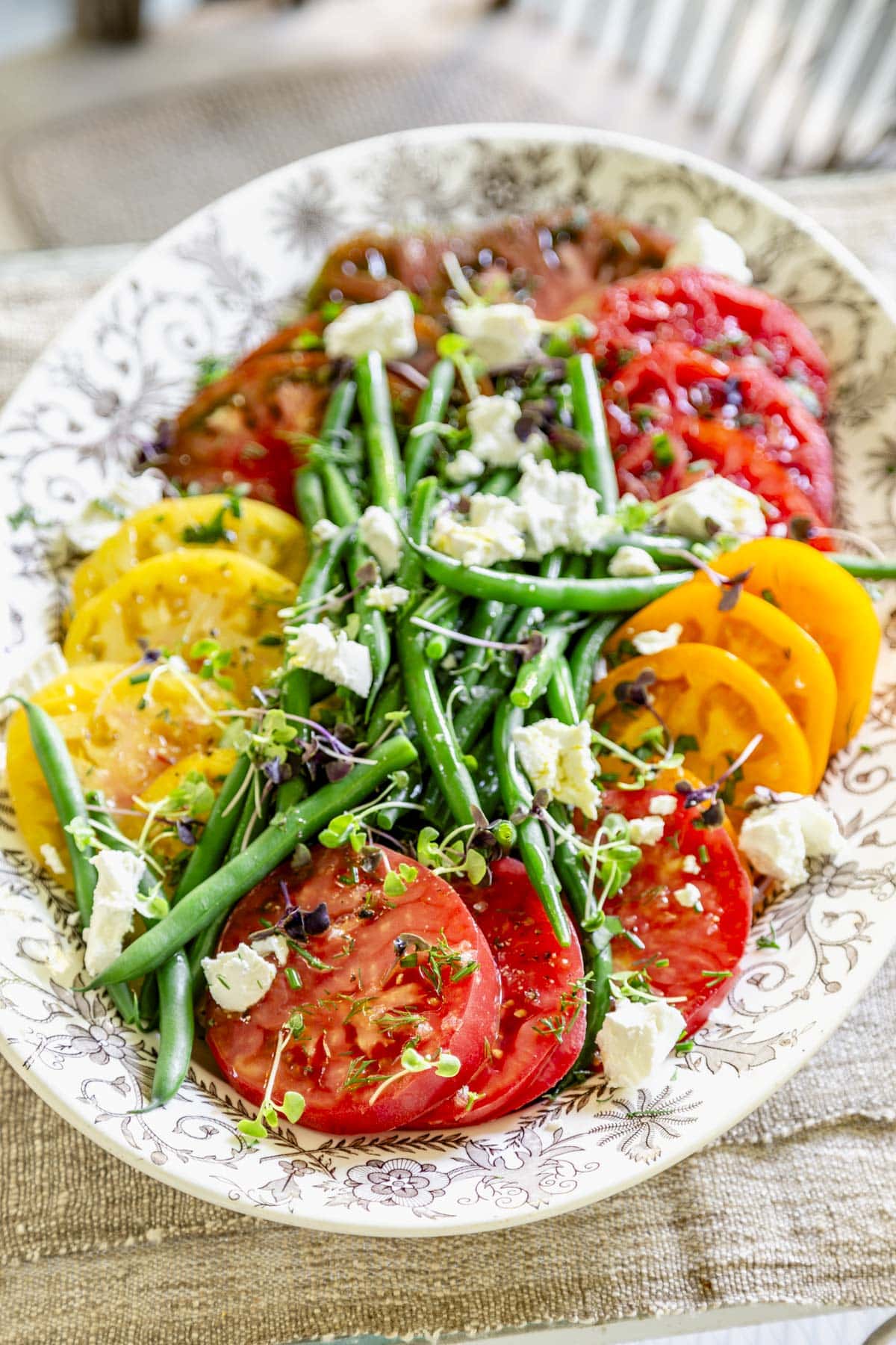 close-up of the tomato green bean salad on a large platter
