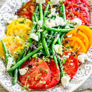 the tomato green bean salad with goat cheese and microgreens