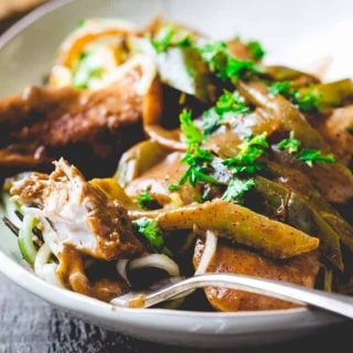 This Healthy Chicken Paprika Skillet from Healthy Seasonal Recipes with saut&eacute;ed onions and peppers, tons of tasty paprika, a little sour cream and served over healthy low carb zucchini noodles is ready in 20 minutes and made in one pan!