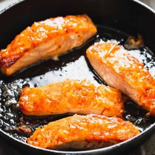 glazed salmon in a skillet, close up
