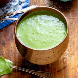 the creamy pureed kale soup in a ceramic bowl
