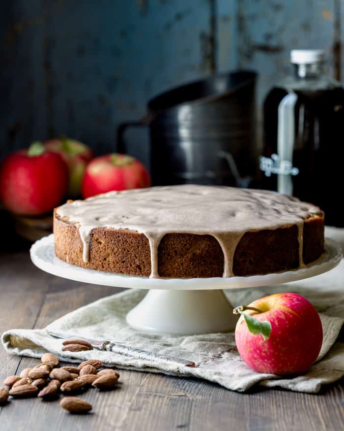 an apple cake on a cake stand