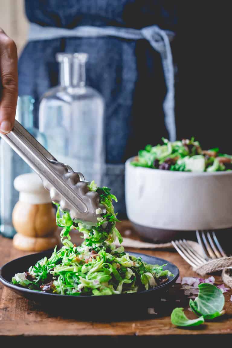Brussels Sprouts Slaw with Bacon and Blue Cheese on a plate