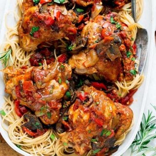 chicken on a platter of pasta