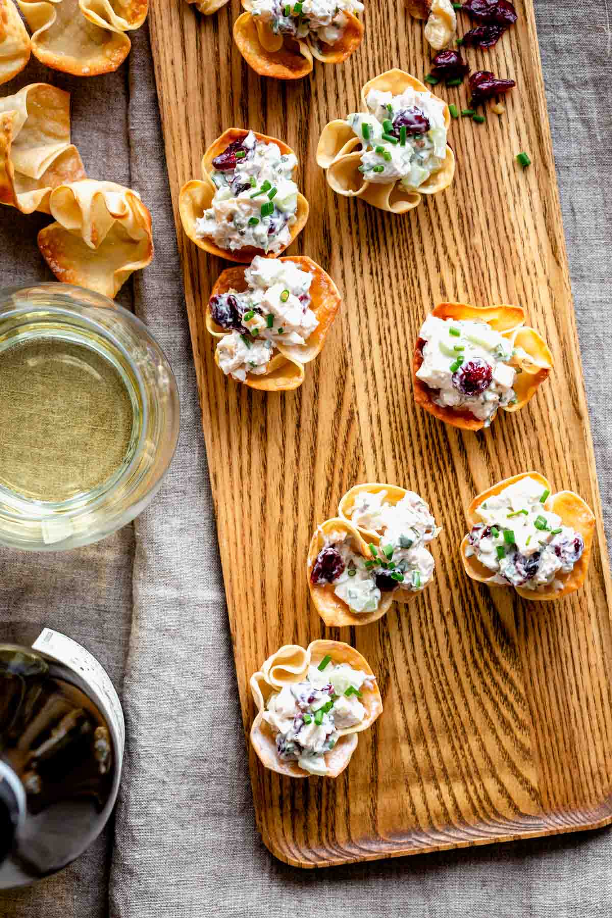 chicken salad bites on a wooden plank